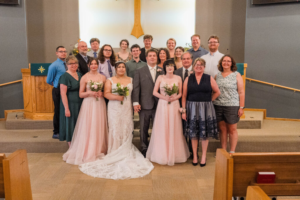 Whole Family Photo after the wedding at Cormorant Lutheran Church in Cormorant, MN 