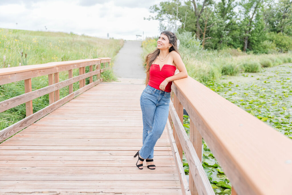 Senior Session in Vergas, MN. Girl wearing Red Top, jeans and black heels 